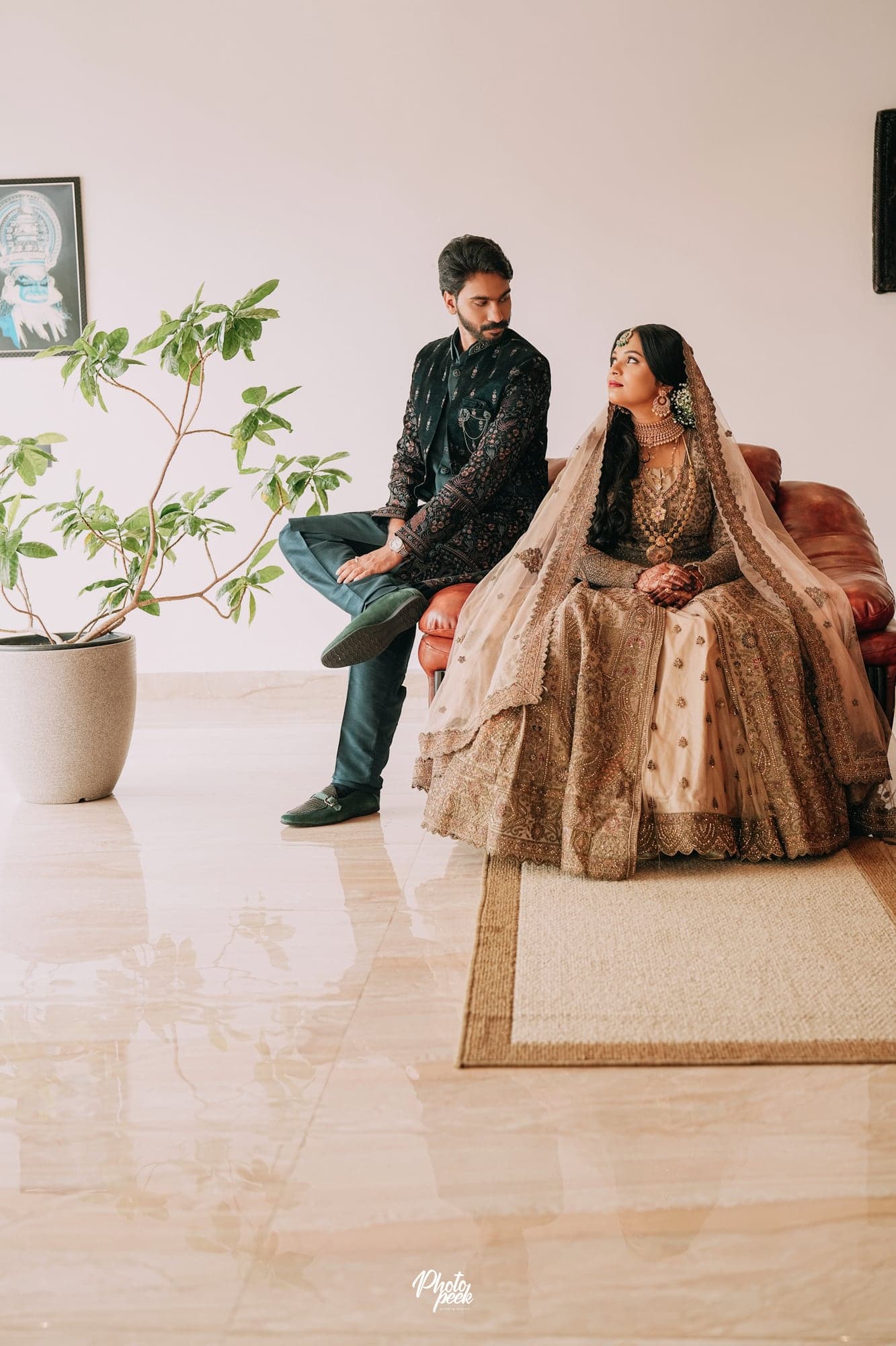 Nisham and Fazna seated together on their wedding day